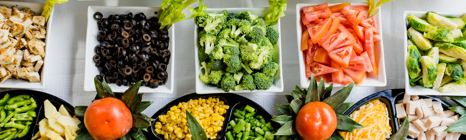 Assorted fresh vegetables arranged in bowls
