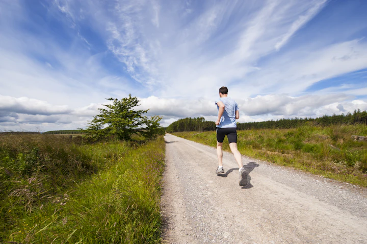 Runner jogging along a quiet country road