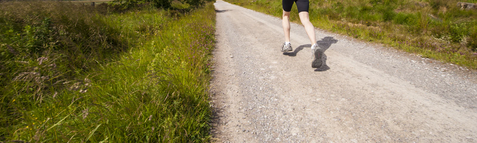 Runner jogging along a quiet country road